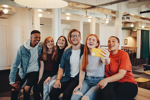 Students taking selfie in college campus