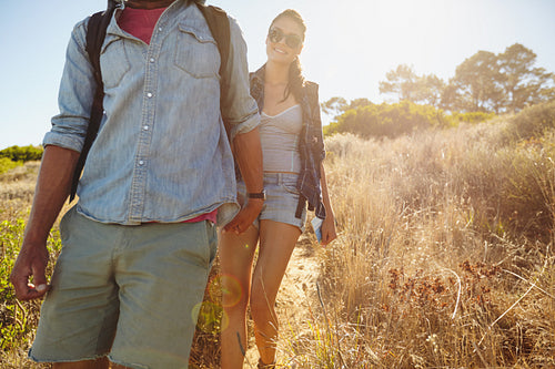 Young woman hiking in mountain with her boyfriend