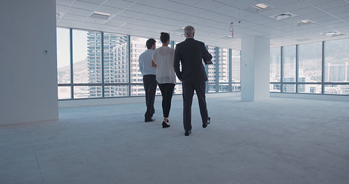 Businesspeople discussing interior plan with architect