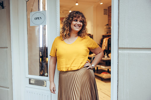 Happy clothing store owner