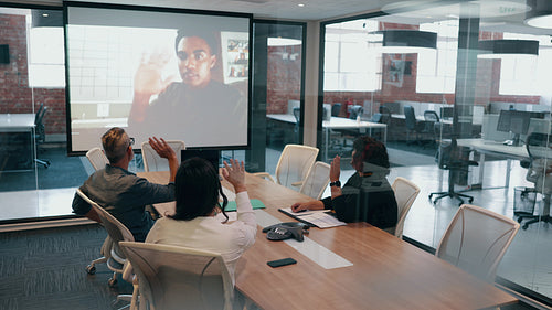 Virtual boardroom meeting: Diverse team exploring a new partnership over a video conference