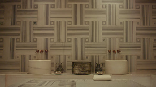 Elegant and traditional marble hammam interior showcasing a luxurious spa bath