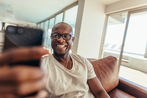 Man using mobile phone for video call