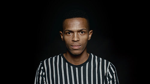 African man staring at camera