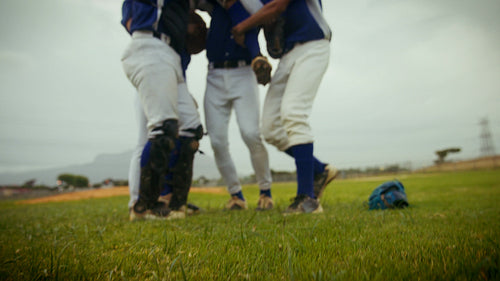 Baseball team celebrates victory after game