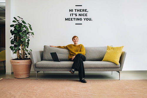 Confident businesswoman sitting in lobby