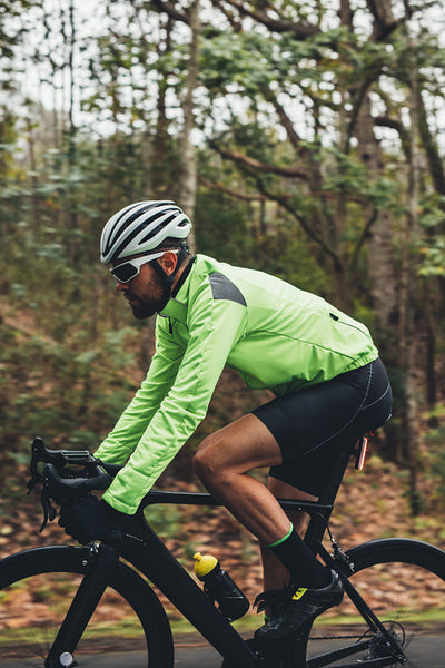 Professional cyclist riding bike outdoors