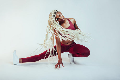 Athletic woman doing fitness exercises