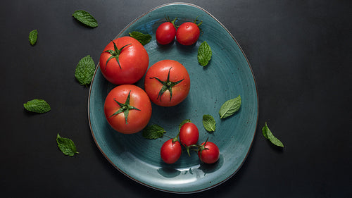 Tomatoes and mint in a plate