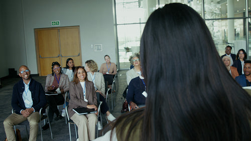Professionals actively participating in an engaging and informative business conference session