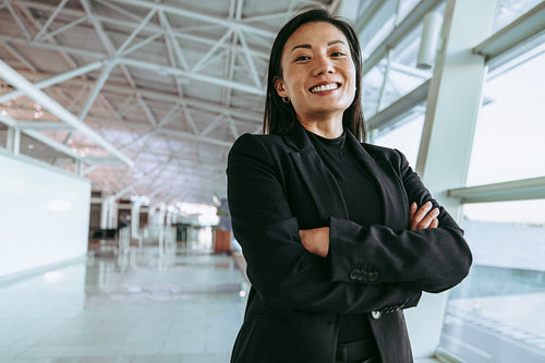 Smiling woman waiting at airport terminal