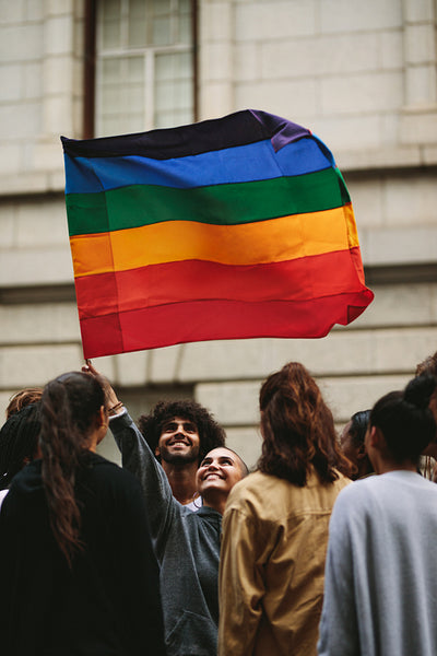 Happy parade goers in gay pride march