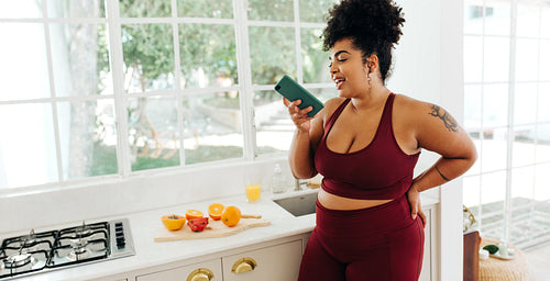 Healthy female sending voice mail with her smart phone