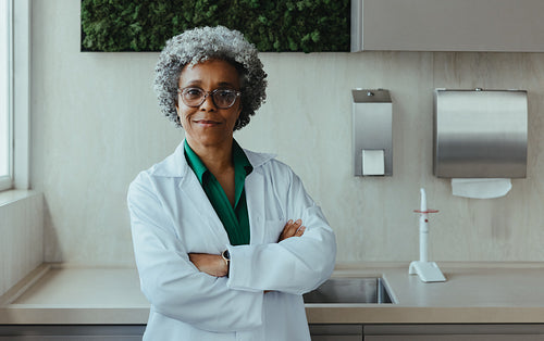 Dentist stands in dental clinic with hygiene setting