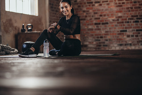 Monitoring her fitness performance on smartwatch