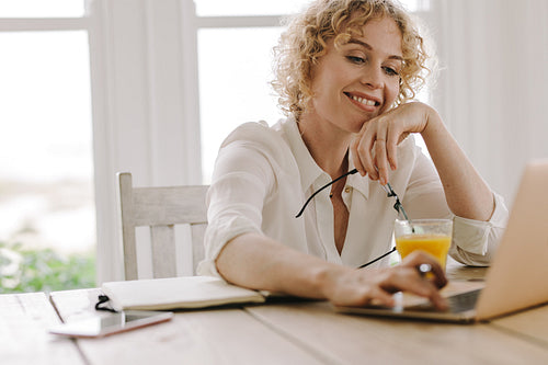 Happy woman working from home