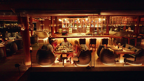 A couple enjoying a romantic evening stroll to dinner at a luxury resort