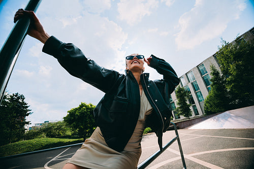 Urban street style portrait of a young woman outdoors