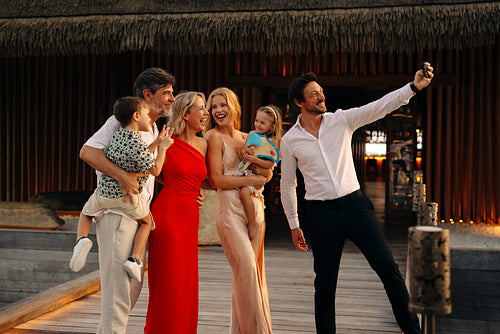 Family enjoying a celebratory moment captured on vacation at a resort destination