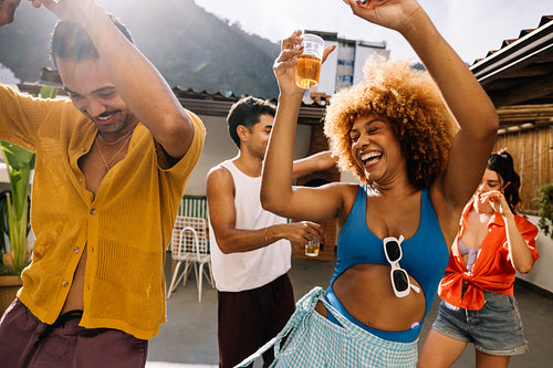 Group of friends dancing and enjoying time outdoors in Rio de Janeiro