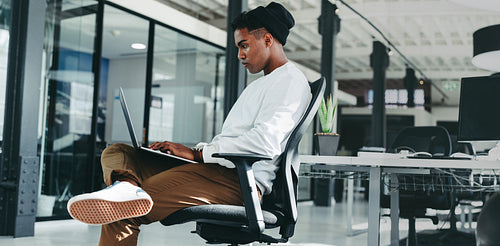 Businessman working on a new software programme in an office