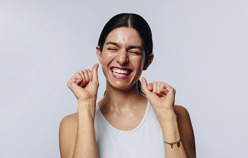 Woman flosses teeth with dental floss in studio