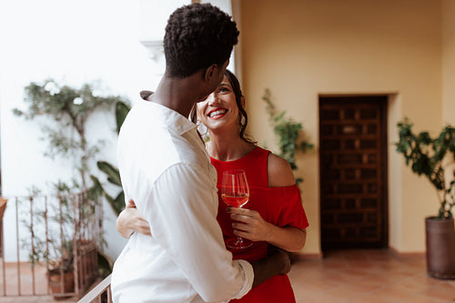 Couple smiling at each other while embracing warmly