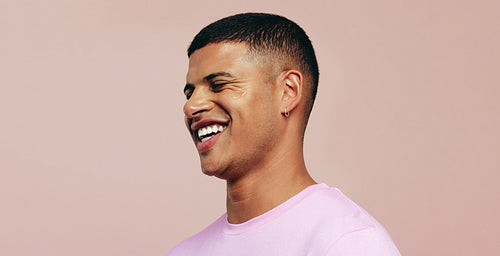 Embracing beauty and skincare: Man with a youthful appearance standing in a studio