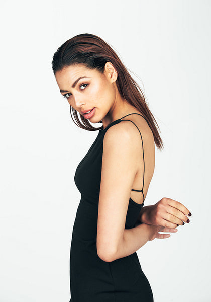 Portrait of a beautiful young woman in black dress