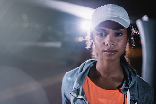 Woman resting after night run in the city