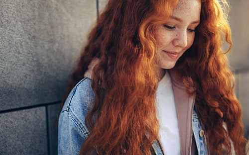Female student at a wall