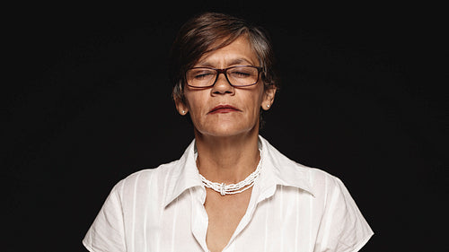 Senior woman with eyes closed