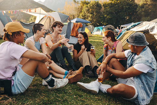 Group of friends gathering and having drinks together, creating lasting memories of an unforgettable festival experience