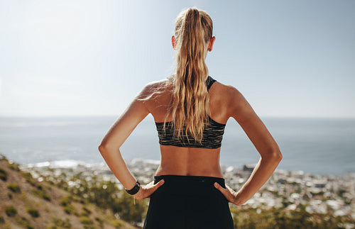 Female runner taking break from running