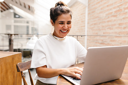 Creative businesswoman having an online meeting in her office