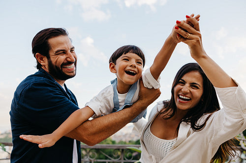 Happy family enjoying a playful moment outdoors together