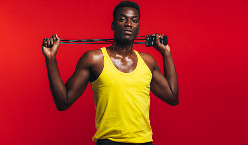 Muscular man with skipping rope