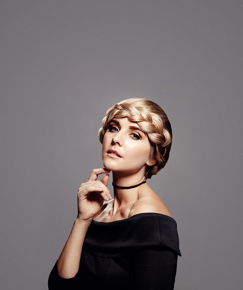 Sensual woman with perfect skin and braided hair style