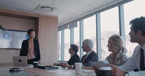 Confident businesswoman giving a presentation to her team