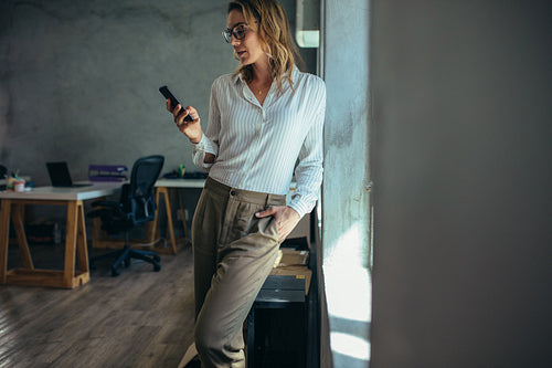 Female entrepreneur using mobile phone