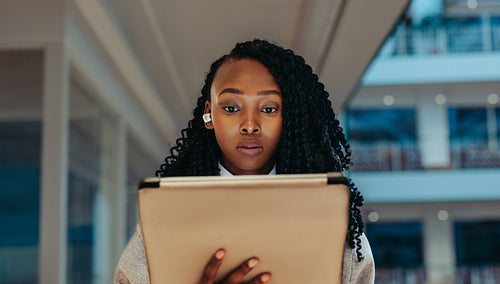 Corporate professional working on a digital tablet
