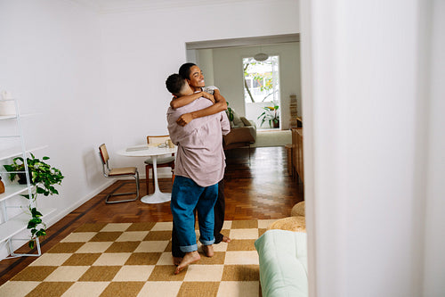 Happy gay couple enjoying happiness at home