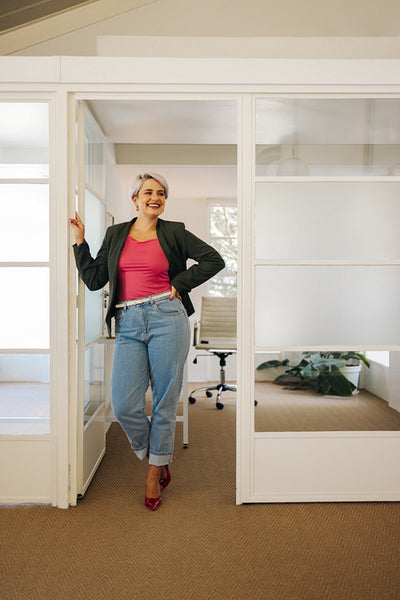 Businesswoman smiling cheerfully in a modern office