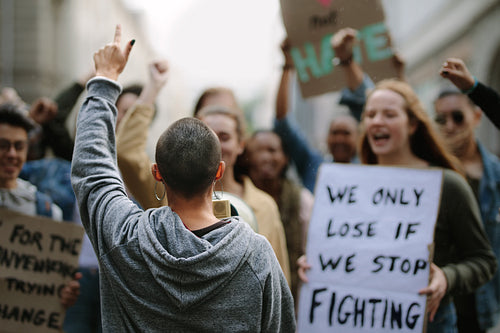 Youngsters protesting with posters and megaphone