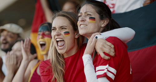Enthusiastic German fans cheering in game