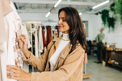 Woman shopping for fashionable clothing in a boutique