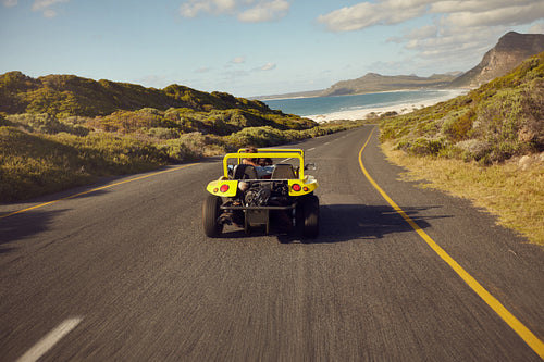 Young couple on road trip in buggy car