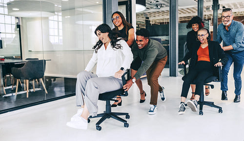 Businesspeople enjoying some playtime in the office