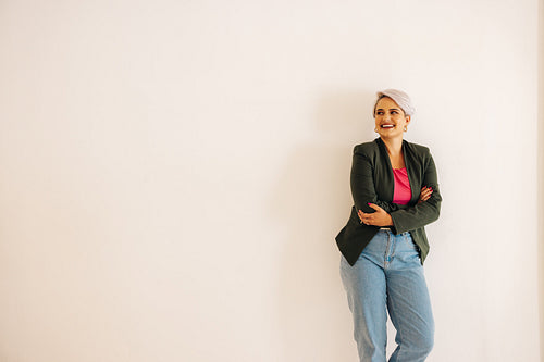 Successful businesswoman looking away with a smile