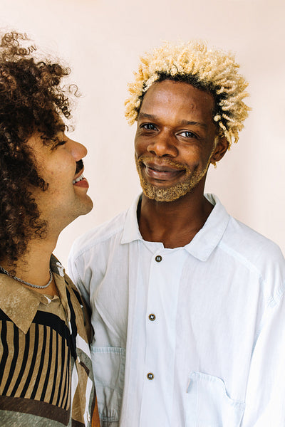Young gay man standing with his lover